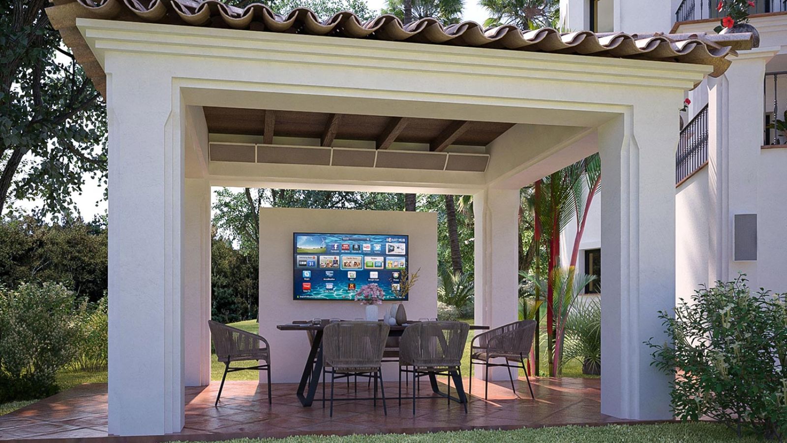 A poolside view with a modern planter-speaker setup, complementing a large, elegant house in the background.