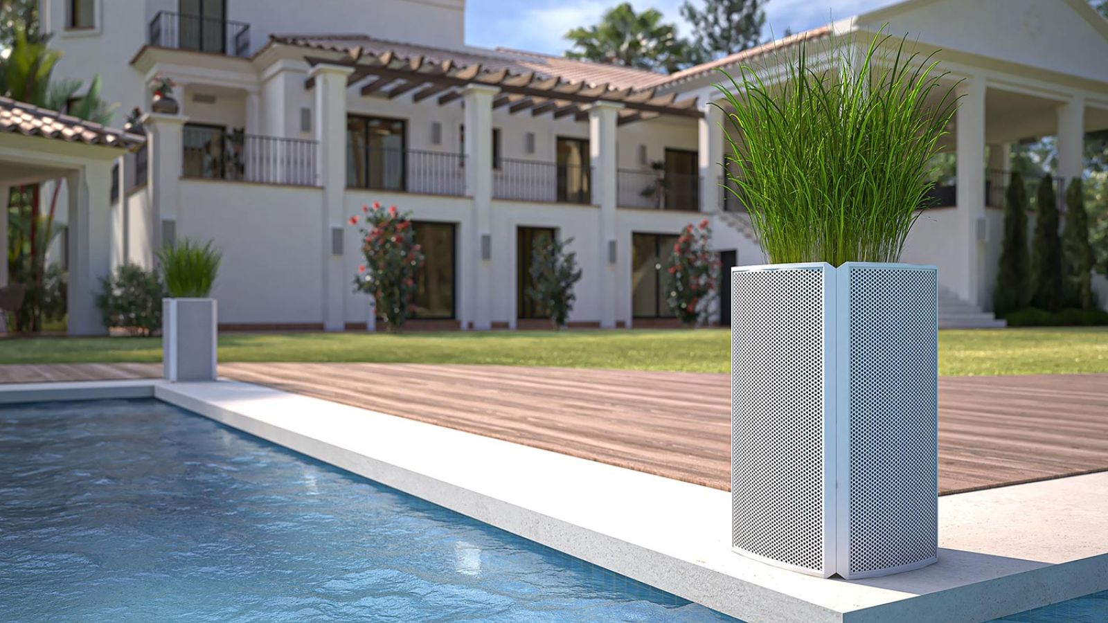 Poolside view with modern planters and a large villa in the background.