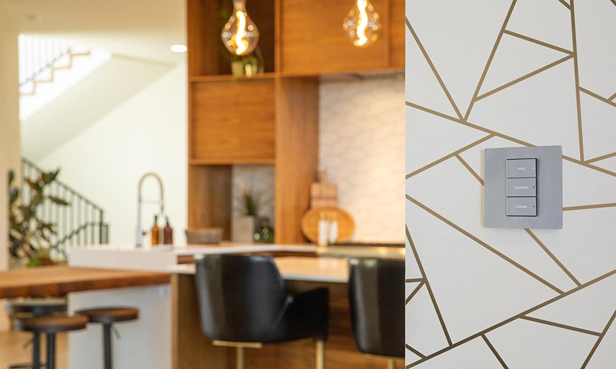 A sleek keypad with three customizable buttons mounted on a geometric-patterned wall in a contemporary kitchen.