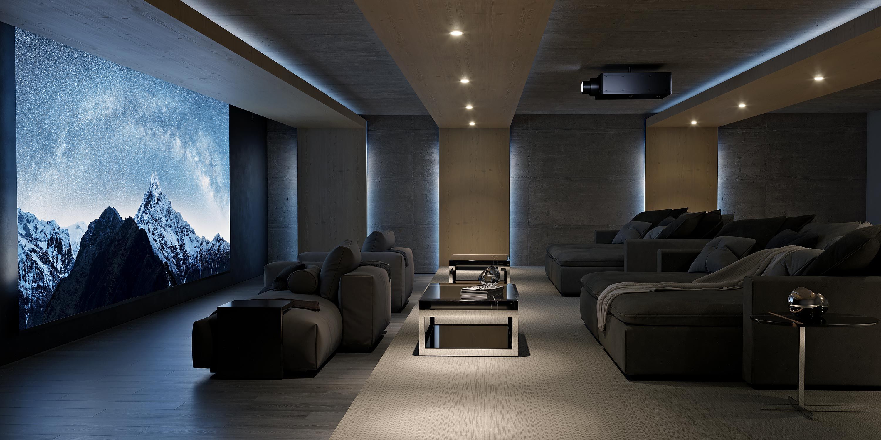 A luxurious home theater with plush recliners and a large screen displaying a mountain landscape scene.